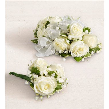 White miniature rose wrist corsage and matching boutonniere